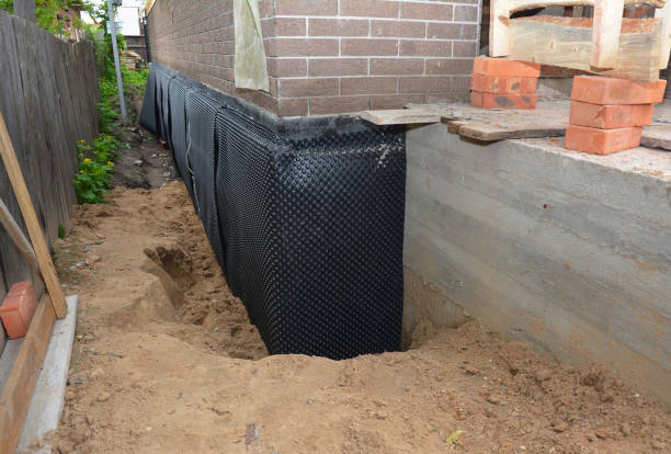 Happy homeowners after waterproofing job in Mount Hope